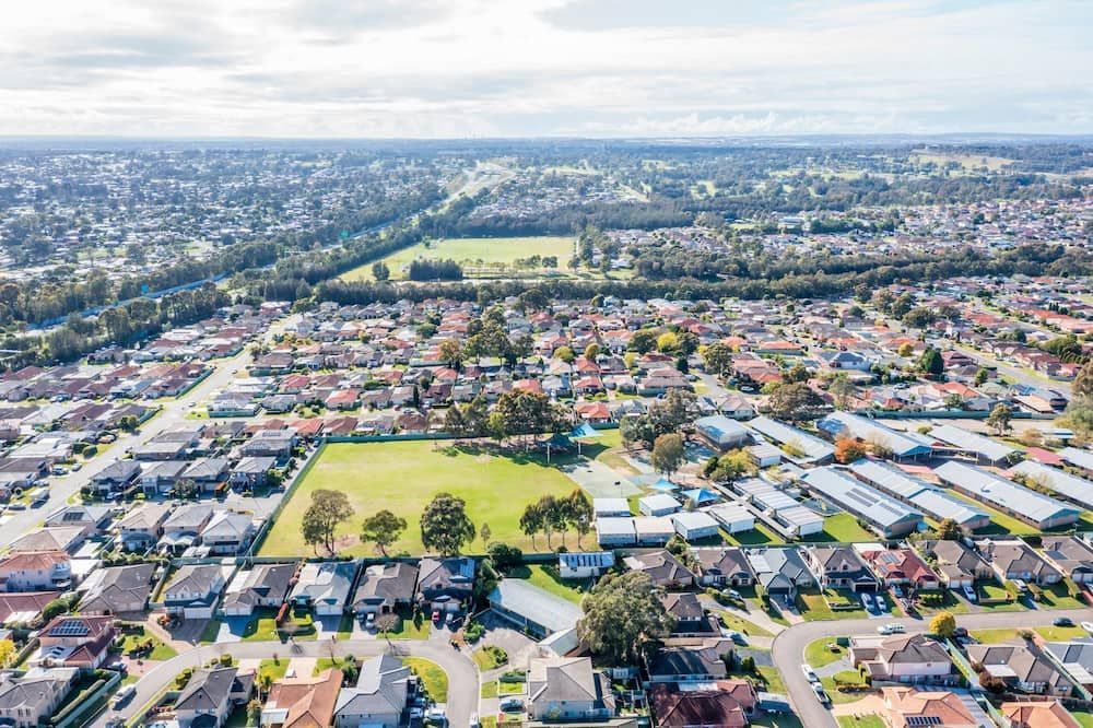 An Aerial View Of A Residential Area With Lots Of Houses And Trees — Matt Walsh Plumbing in Jindera, NSW