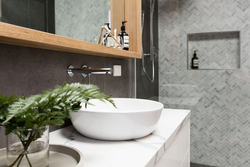 A Bathroom With A Sink, Mirror And Shower — Matt Walsh Plumbing in Bandiana, VIC