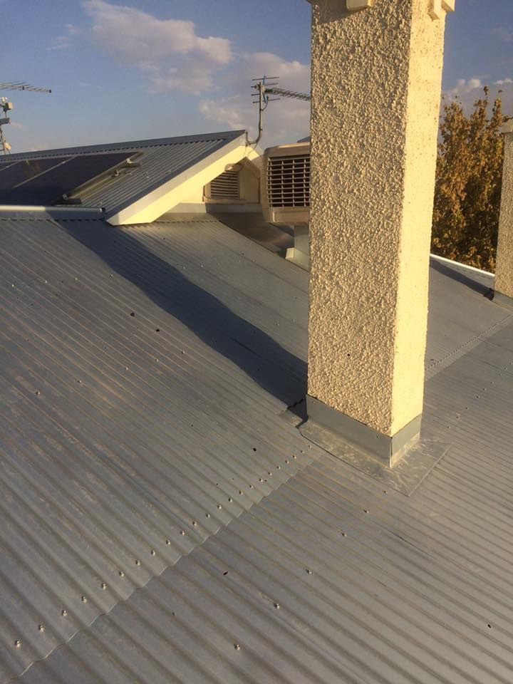 A Roof With A Chimney — Matt Walsh Plumbing in Thurgoona, NSW