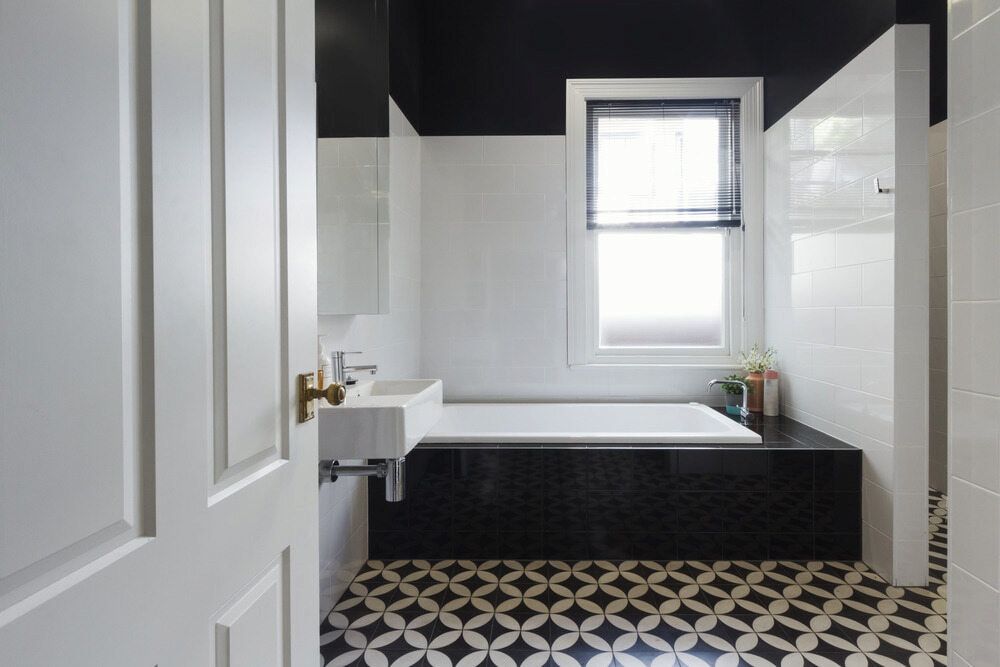 A Bathroom With A Bathtub, Sink, Mirror And Window — Matt Walsh Plumbing in Jindera, NSW