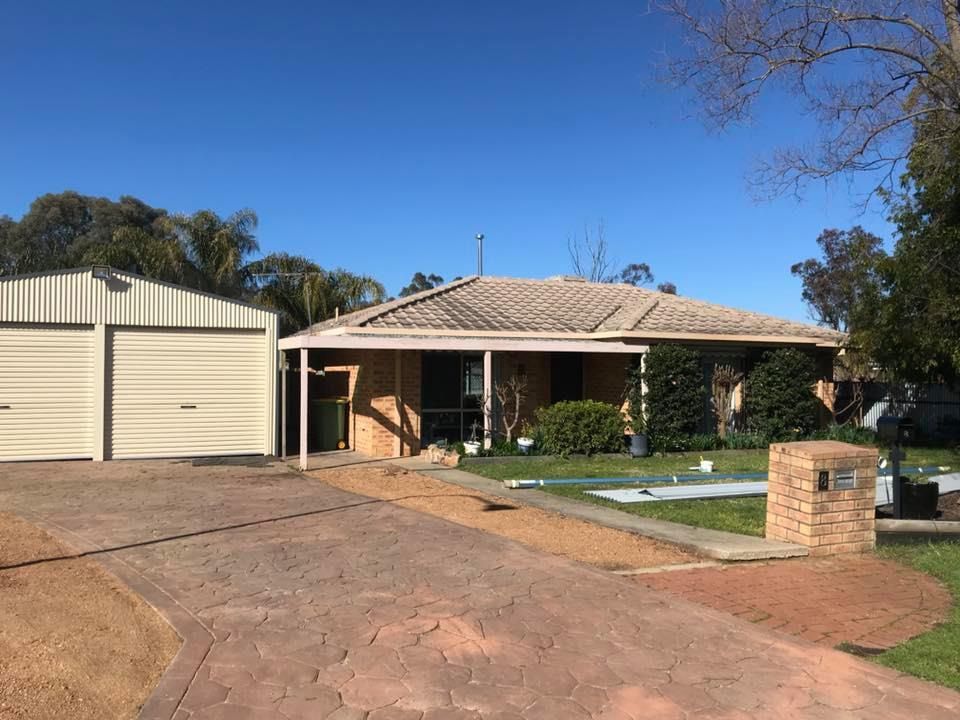 A House With Two Garage Doors — Matt Walsh Plumbing in Thurgoona, NSW