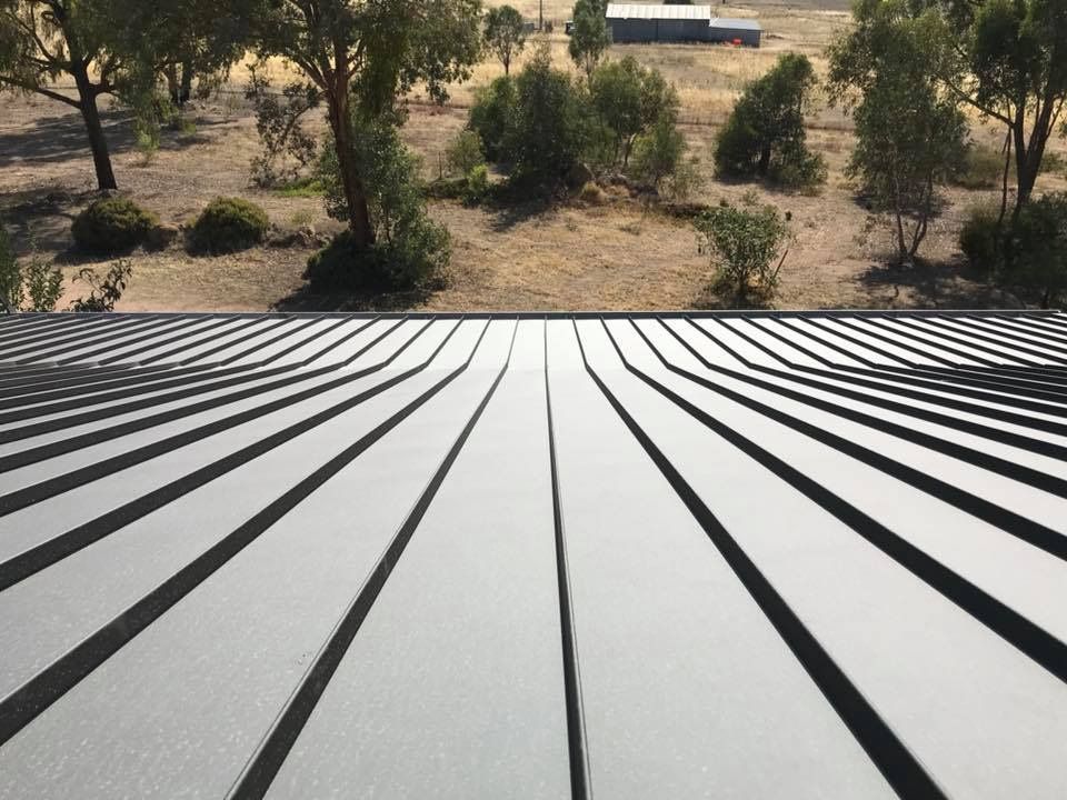 A Roof With A View Of A Field And Trees — Matt Walsh Plumbing in Thurgoona, NSW