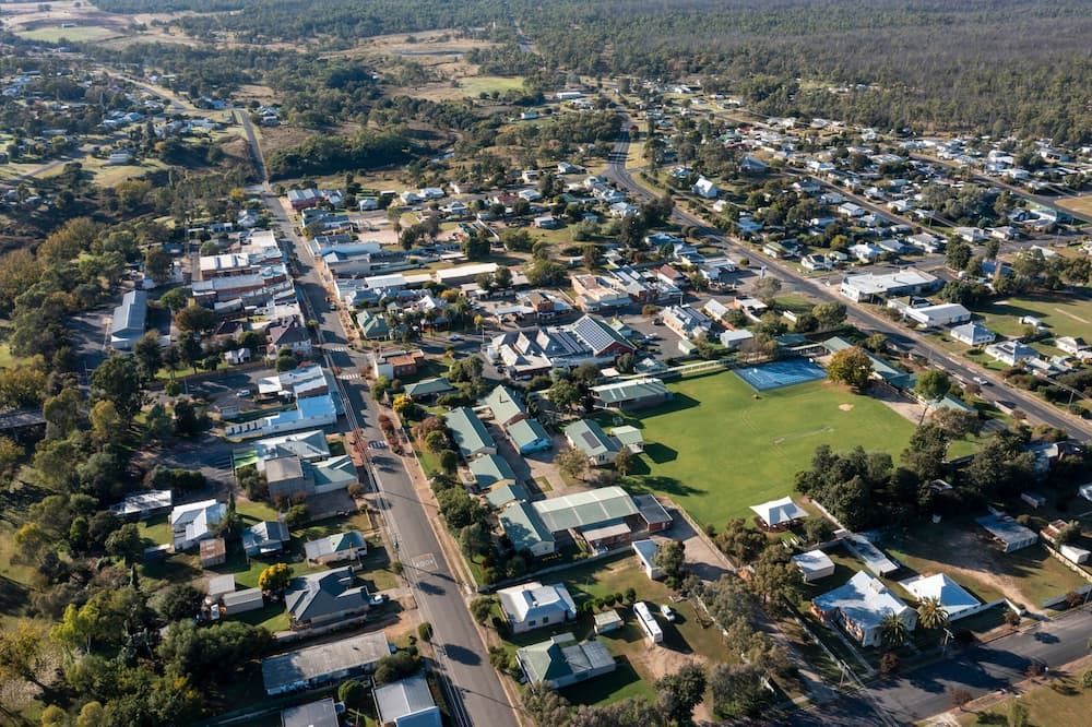 An Aerial View Of A Small Town Surrounded By Trees And Houses — Matt Walsh Plumbing in Thurgoona, NSW