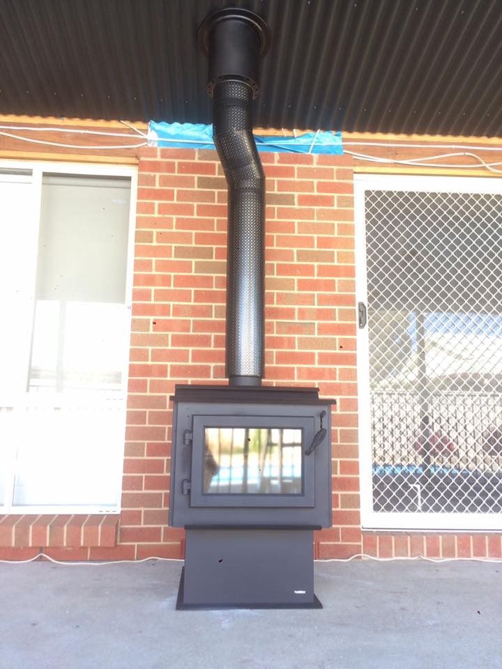 A Black Wood Stove — Matt Walsh Plumbing in Thurgoona, NSW