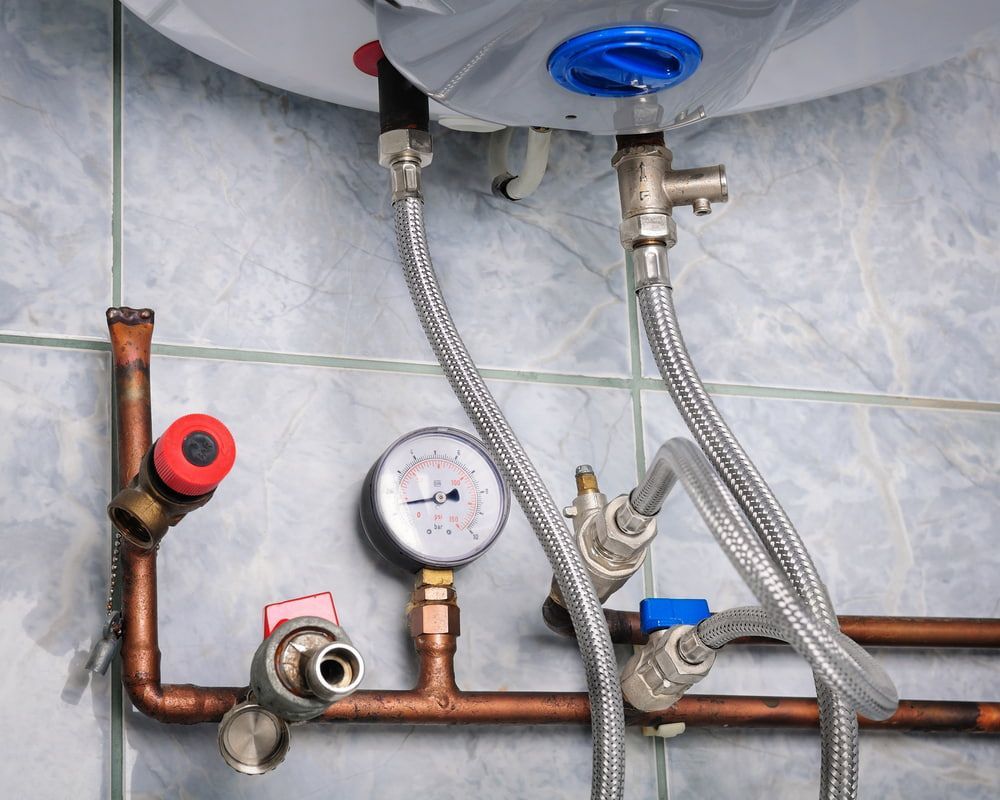 A Water Heater With Copper Pipes Attached To It — Matt Walsh Plumbing in Lavington, NSW