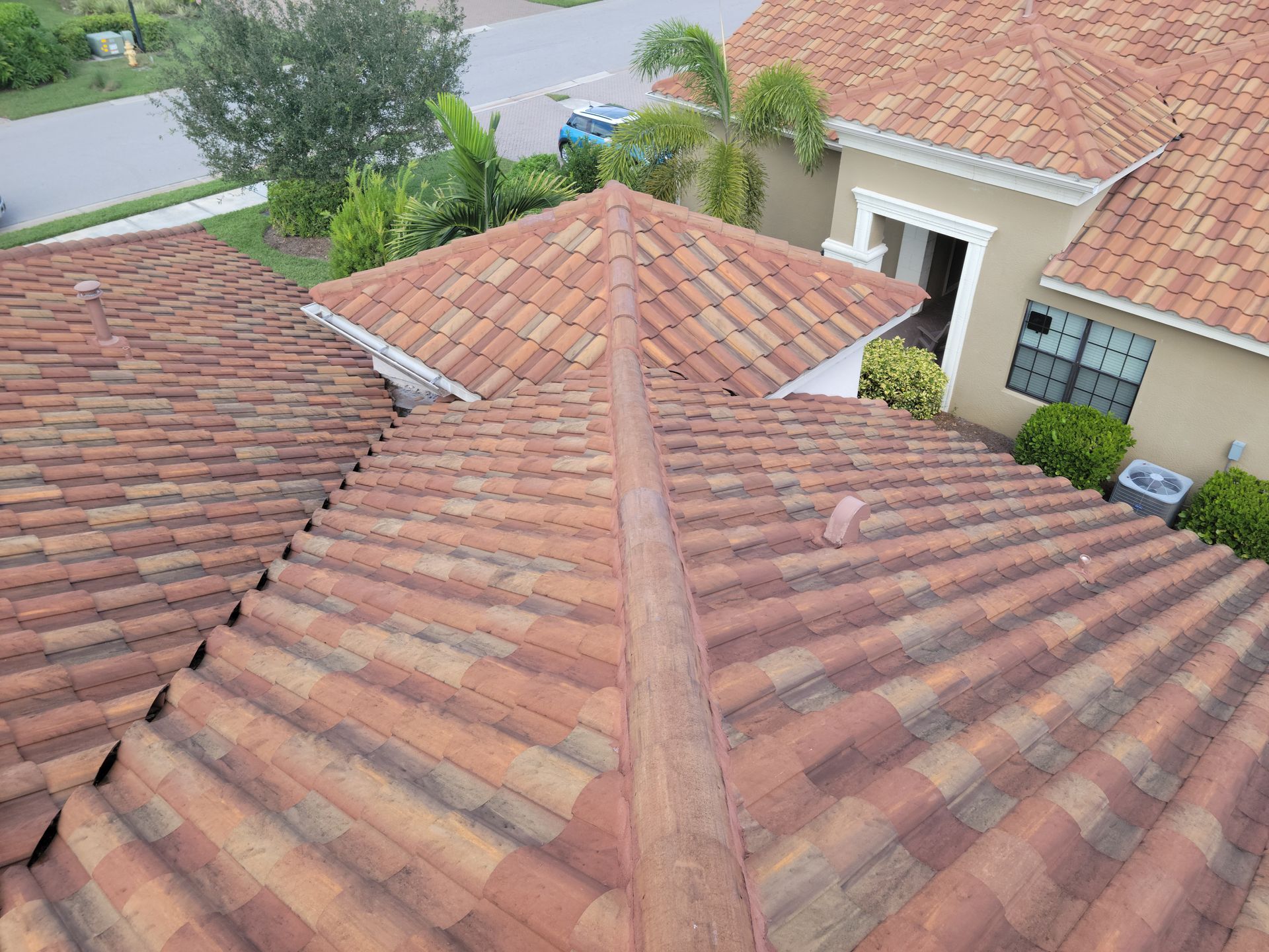 An aerial view of a tiled roof of a house.
