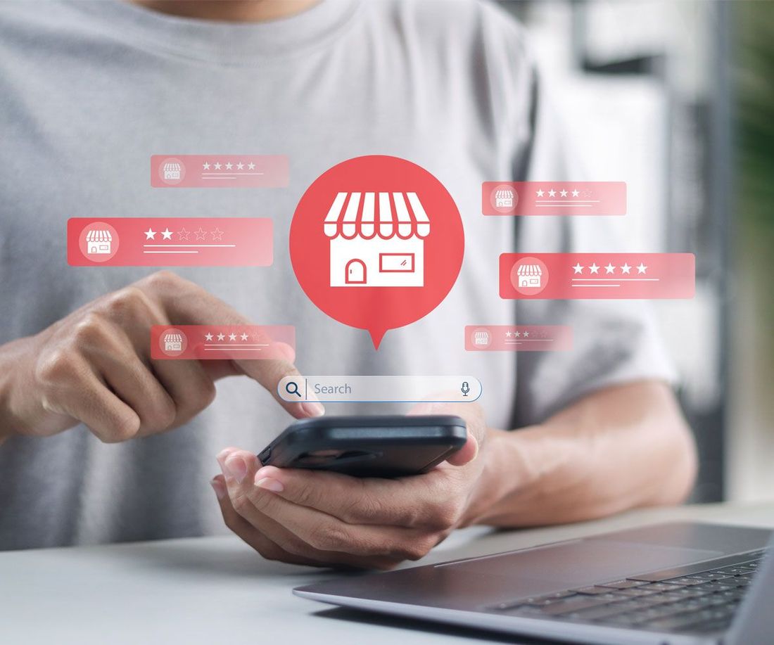 Graphics of local SEO and AEO coming out of mobile phone.