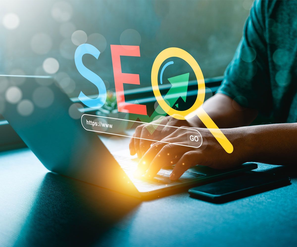 Graphic of SEO search on top of man at computer.