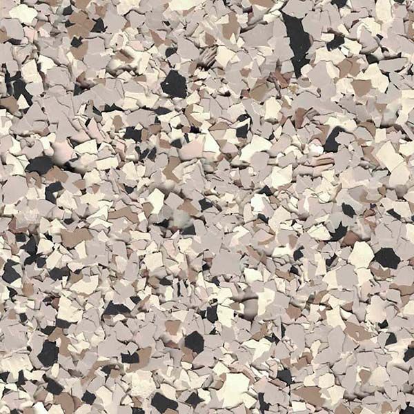 Close-up of assorted small beige, tan, gray, and black textured surface