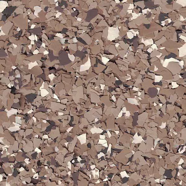 Pile of small speckled tan and brown gravel chips filling the frame.