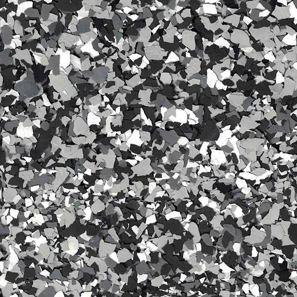 Abstract grayscale confetti-like pattern with scattered black, white, and gray shapes