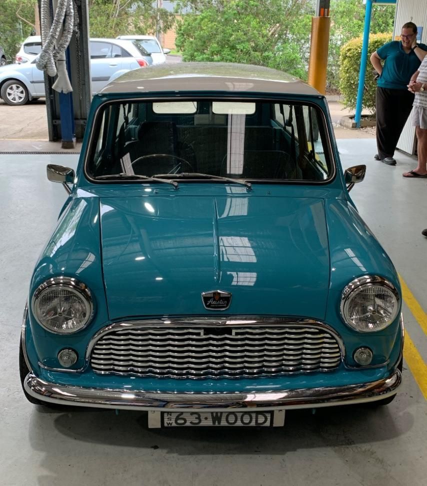 A Blue Car in a Mechanic Garage — Town & Country Removals In Taree, NSW
