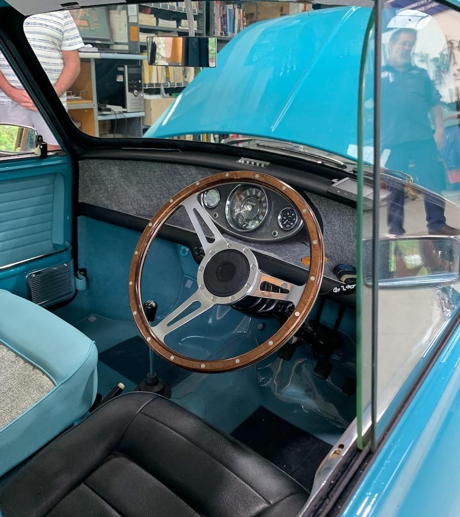 A Blue Car With a Wooden Steering Wheel — Town & Country Removals In Taree, NSW