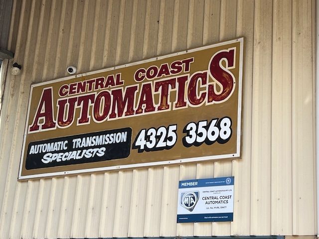 A sign that says central coast automatics on it