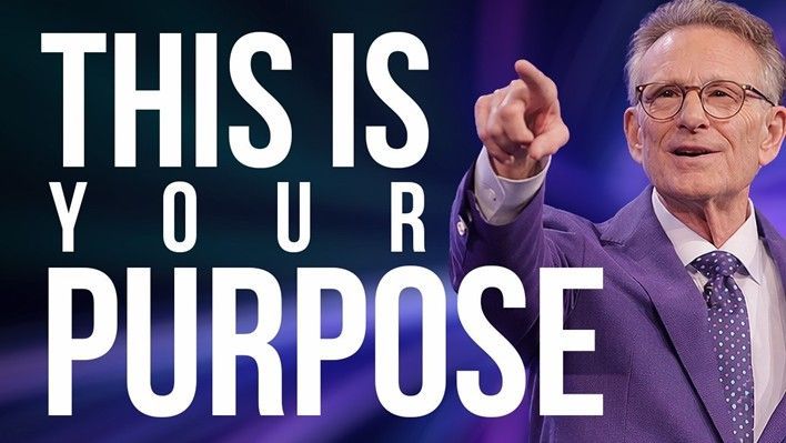 Text graphic reading “THIS IS YOUR PURPOSE” beside a man in a purple suit pointing upward.