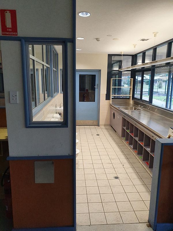 View From The Outside Of The Bathroom With Sink And Toilet Renovation — Entire Trades in Cessnock, NSW