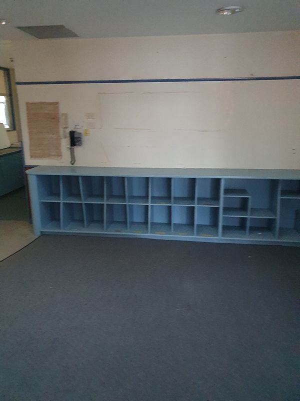 Blue Shelf In A Room Before Renovation — Entire Trades in Cessnock, NSW