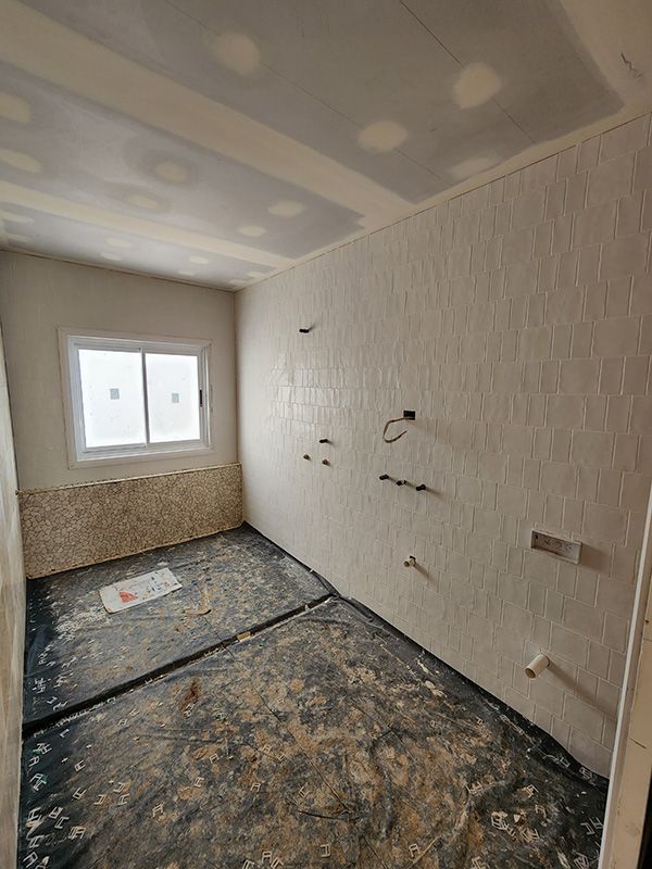 Under Construction Bathroom With Window And Tiles — Entire Trades in Singleton, NSW