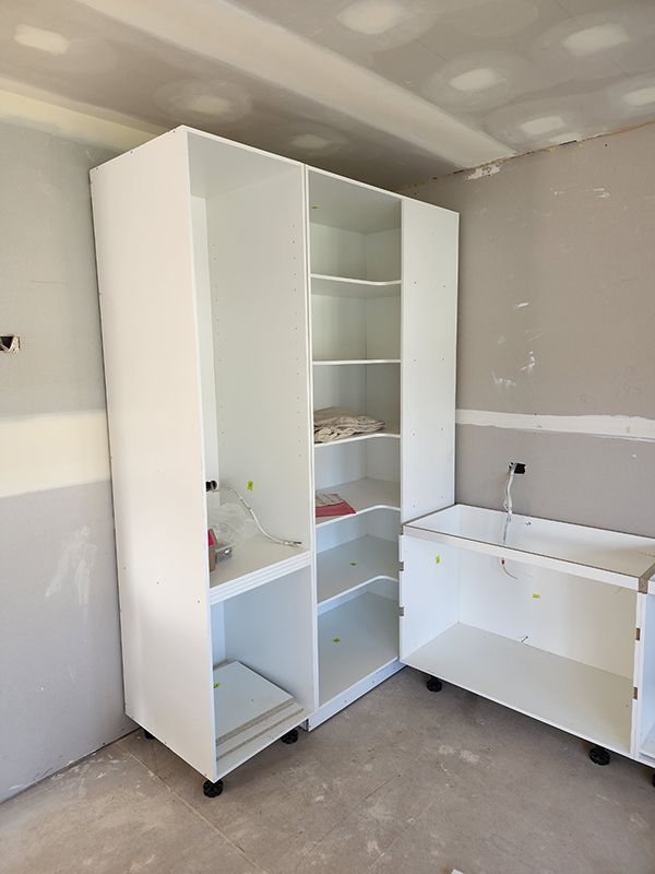 A Room With A Lot Of Shelves And A Sink In It — Entire Trades in Singleton, NSW