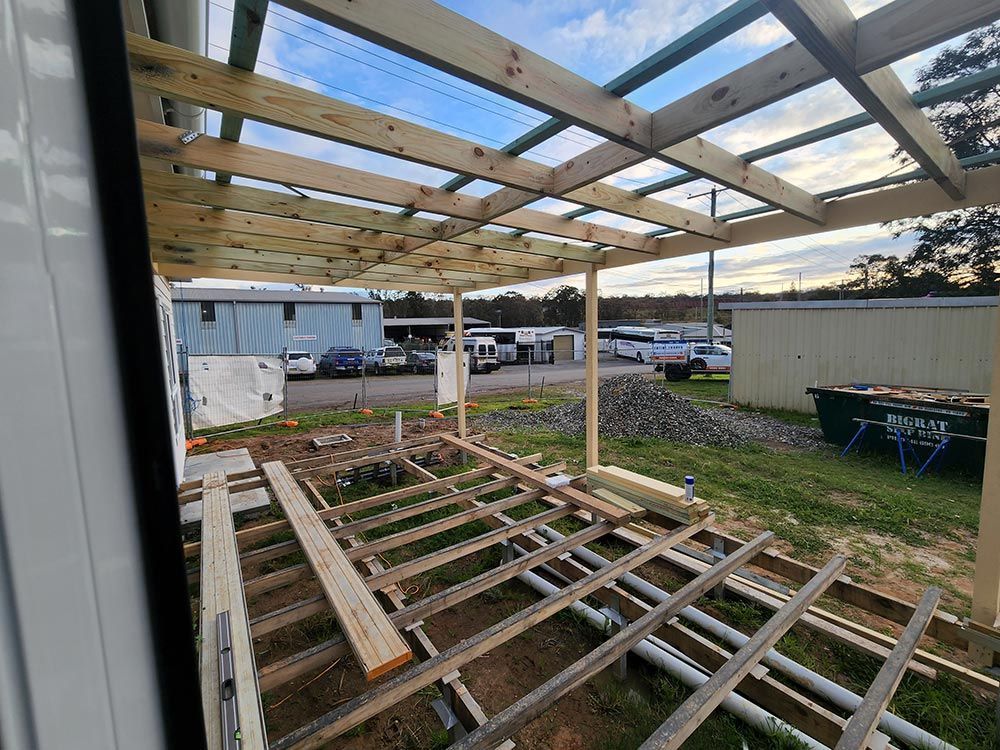 A View Of The Back Of A House Under Construction Deck — Entire Trades in Singleton, NSW