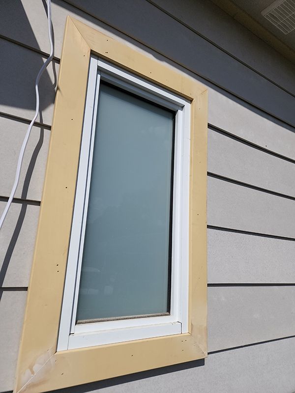 A House Window With A White Frame From Outside — Entire Trades in Cessnock, NSW