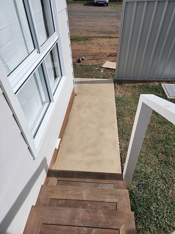  A Wooden Staircase Leading To A Porch And A Window — Entire Trades in Port Stephens, NSW