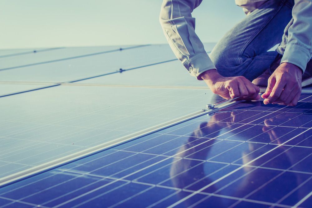  Working On Wrench Tightening Solar Mounting Structure Of Solar Panel — Entire Trades in Port Stephens, NSW