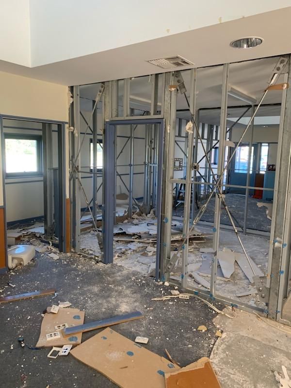 A Room that Is Being Remodeled with A Lot of Boxes on The Floor — Entire Trades in Maitland, NSW