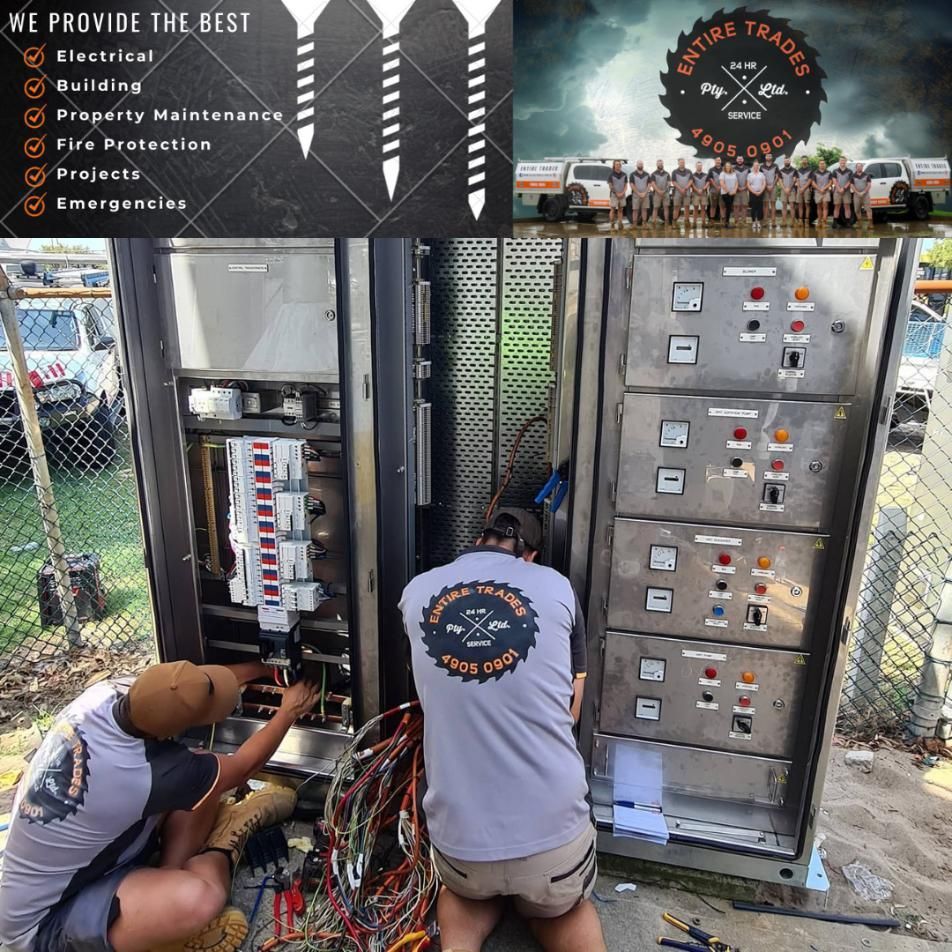 Two Men Are Working on An Electrical Box with A Sign that Says We Provide the Best — Entire Trades in Maitland, NSW