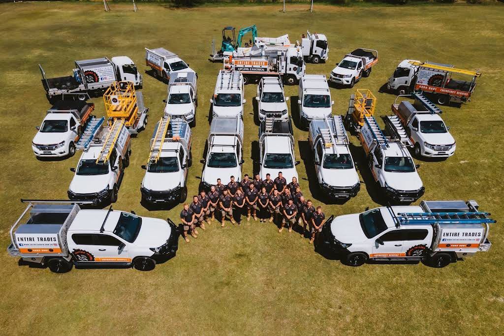 Emegency Electricians with Company Vehicles in The Field