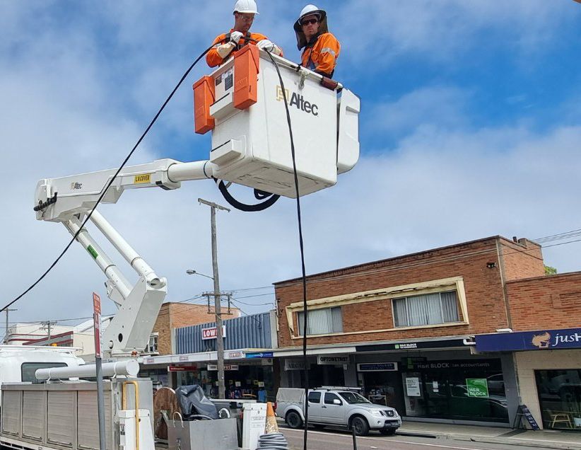 Two Electricians Fixing Electrical Panel