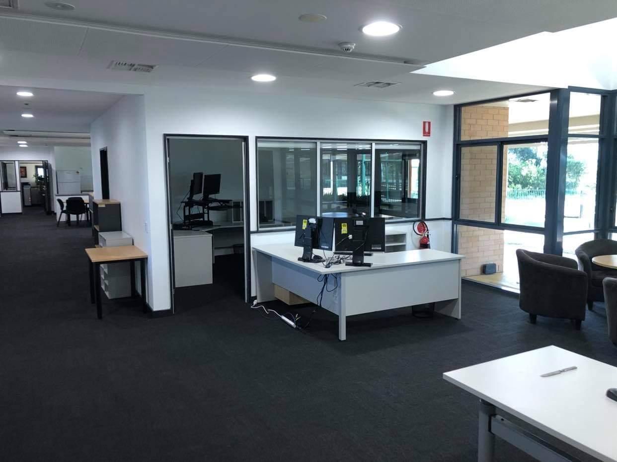 A Large Office with A Lot of Desks and Computers — Entire Trades in Maitland, NSW