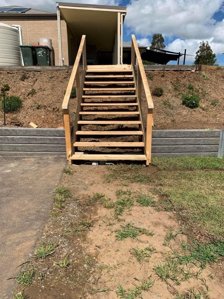 A Set of Wooden Stairs Leading up To a House on A Hill — Entire Trades in Maitland, NSW
