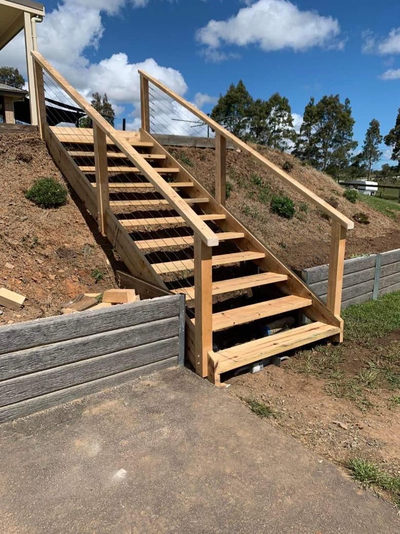 A Set of Wooden Stairs Going up A Hill — Entire Trades in Maitland, NSW