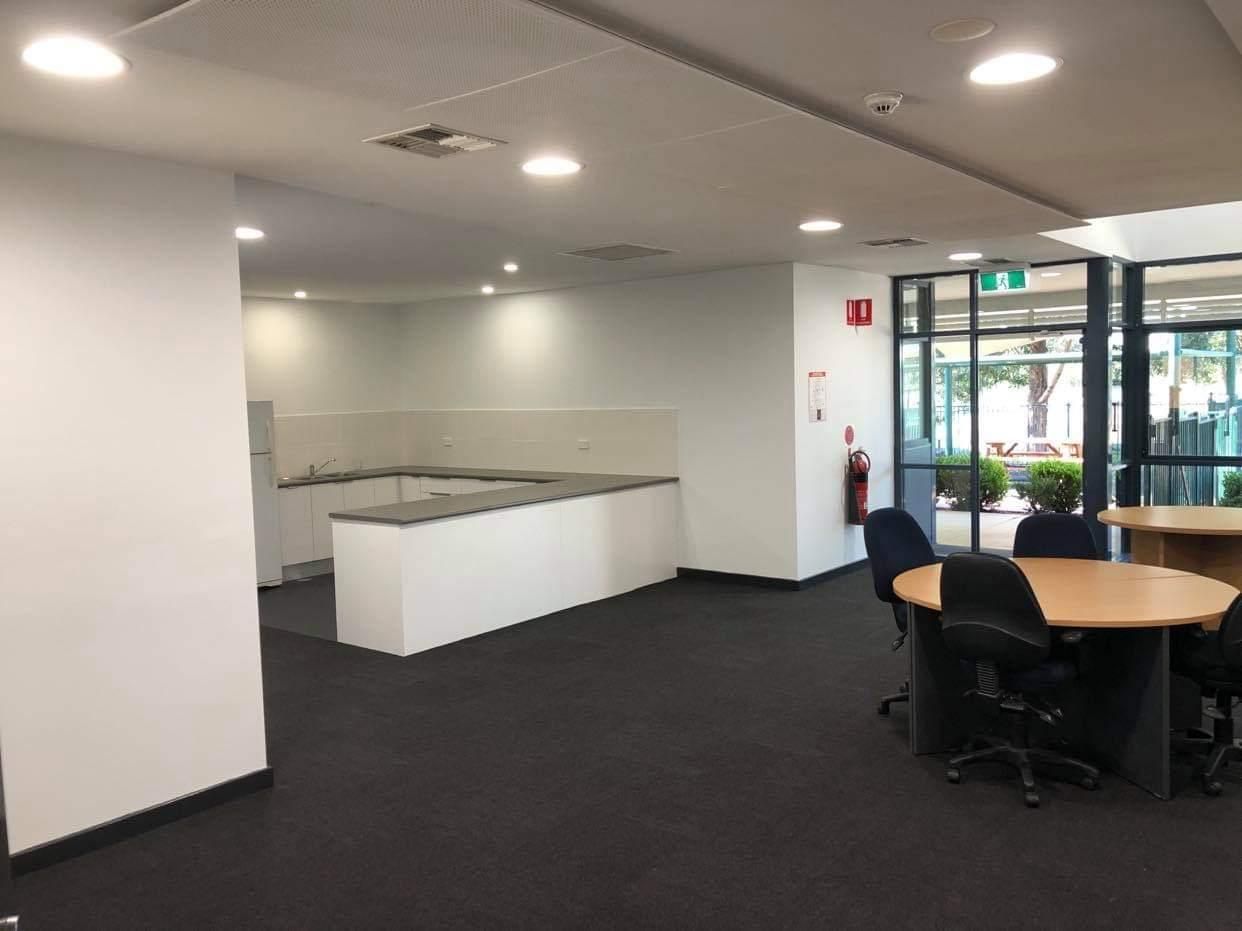 A Large Room with A Table and Chairs in It — Entire Trades in Maitland, NSW