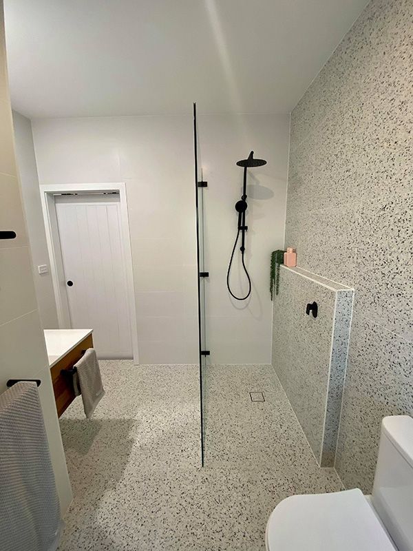 A Shower, Toilet, And Sink In A Bathroom — Entire Trades in Port Stephens, NSW