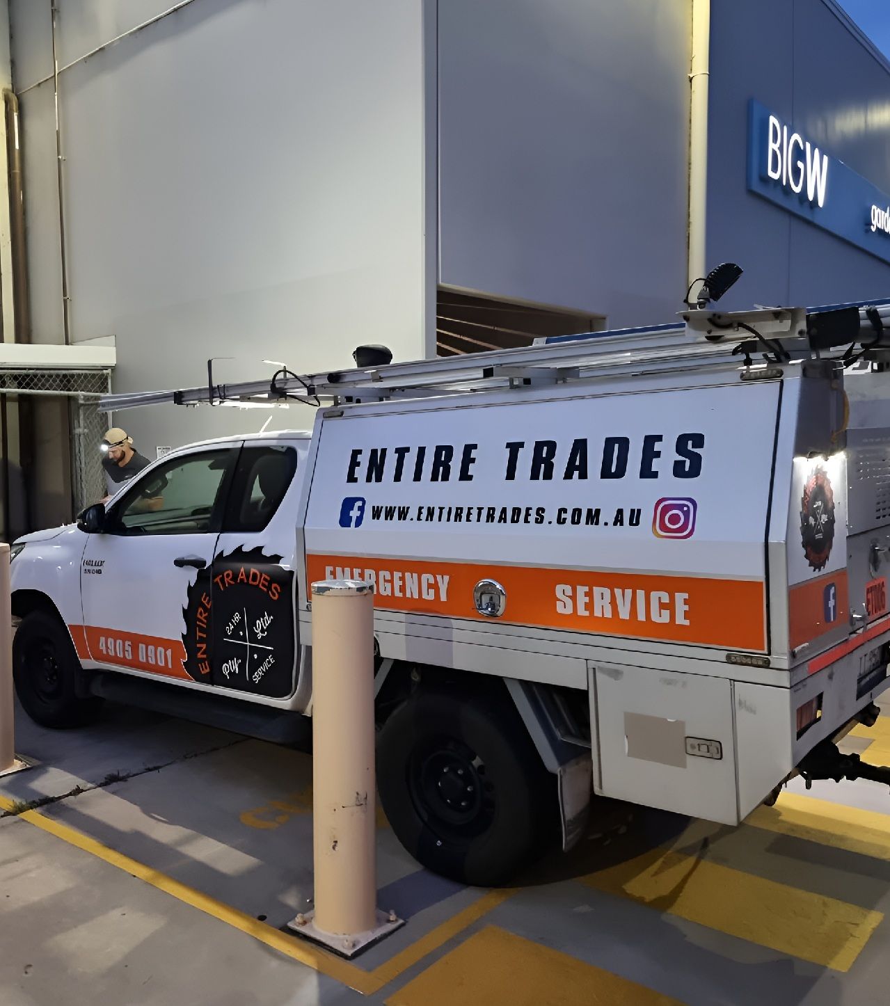 White Utility Truck With “ENTIRE TRADES” Signage Parked Outside — Entire Trades in Cessnock, NSW