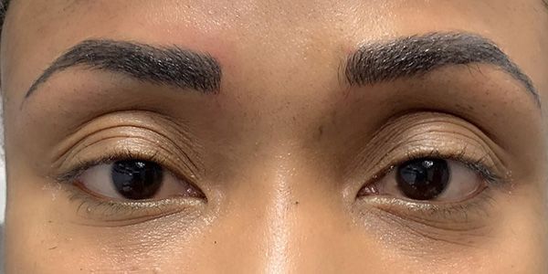 A close up of a woman 's eyes with makeup on.