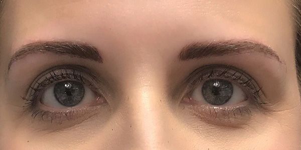 A close up of a woman 's eyes with mascara on.