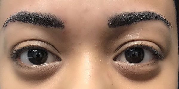 A close up of a woman 's eyes and eyebrows.