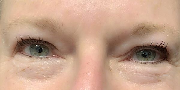 A close up of a woman 's eyes with mascara on.