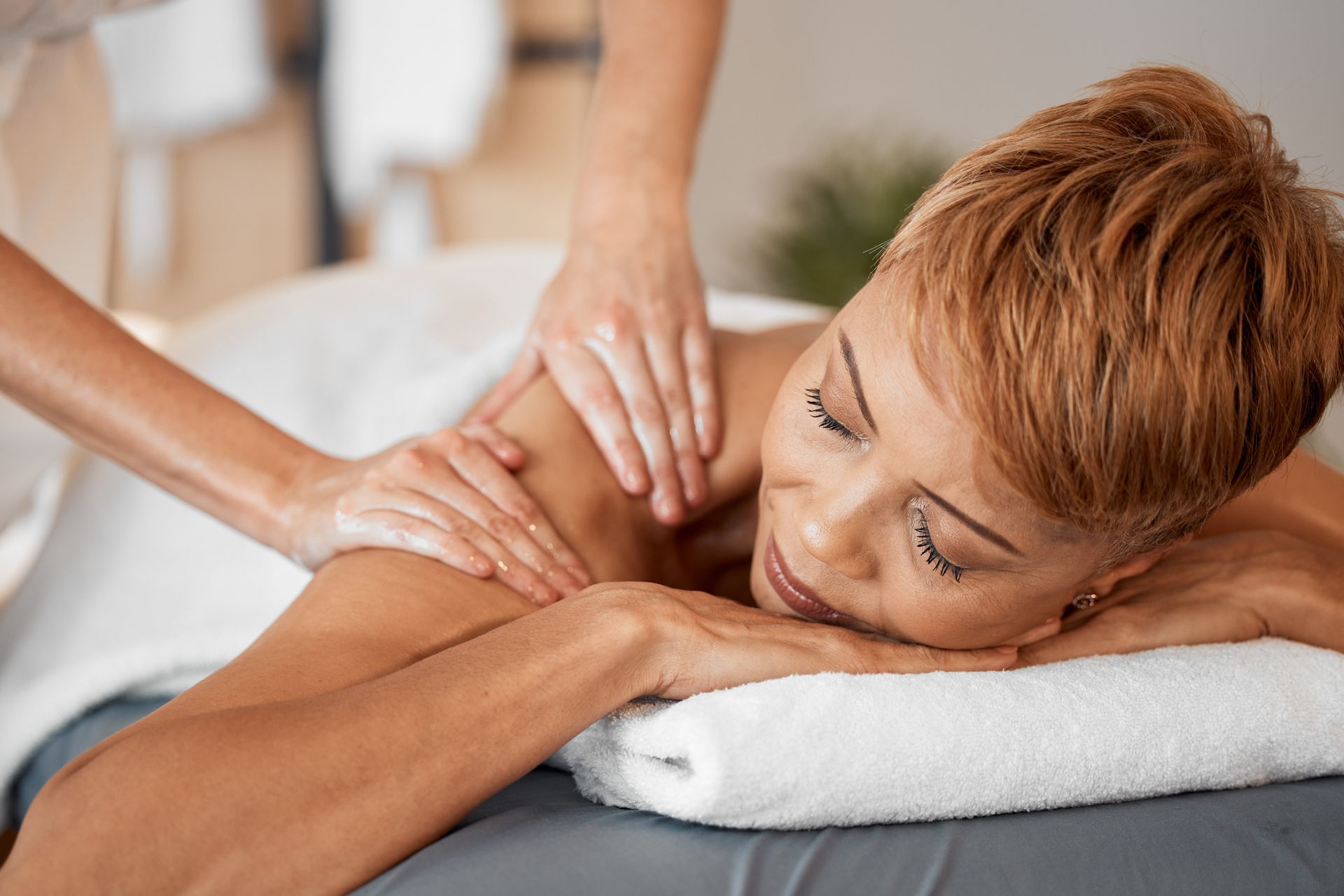 A woman is getting a massage at a spa.