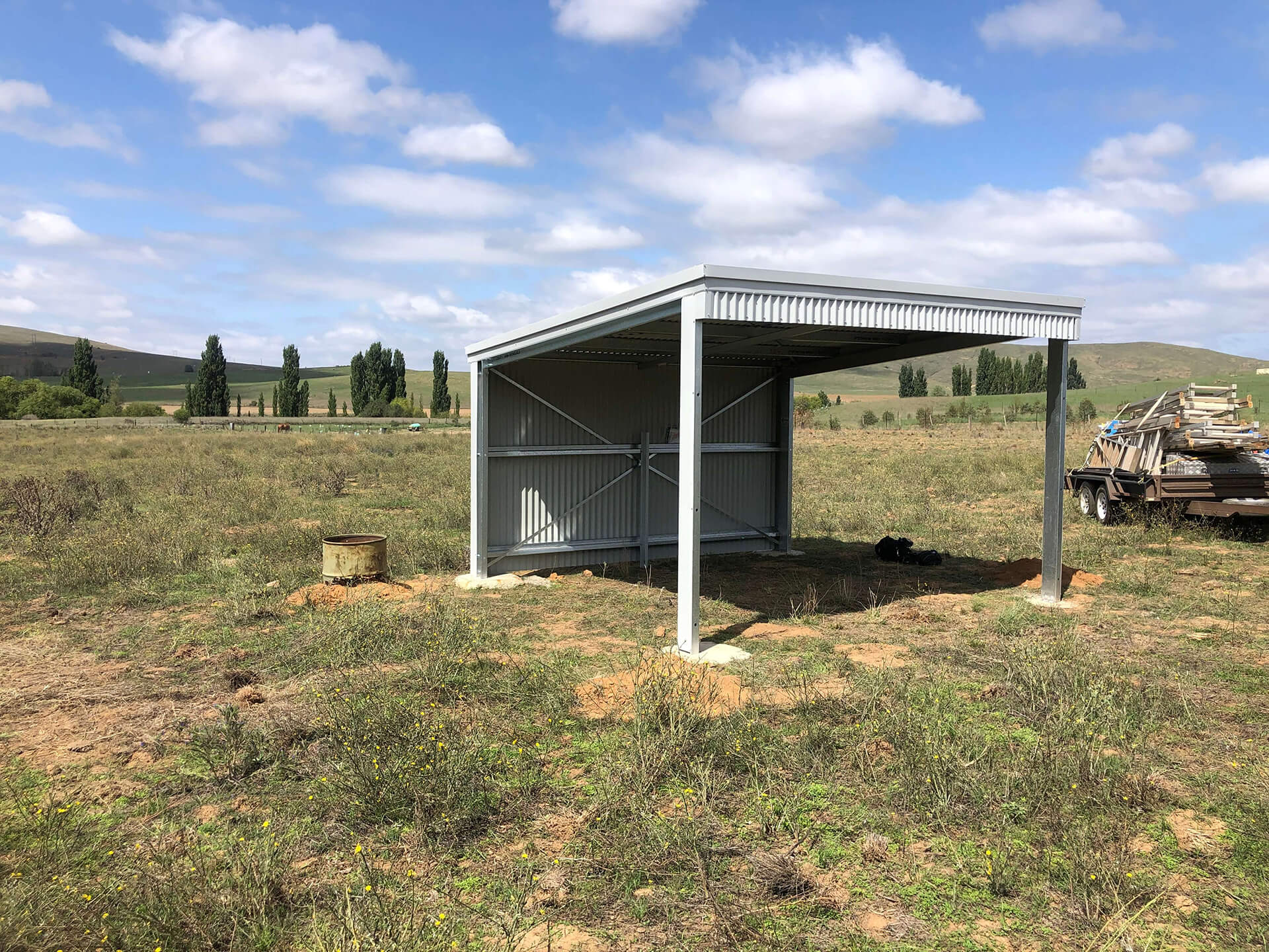 Flat roof Carport attached to house - Snowy Sheds