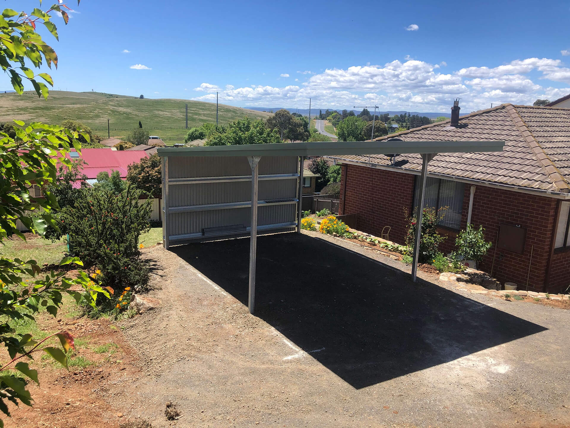 Flat roof Carport attached to house - Snowy Sheds