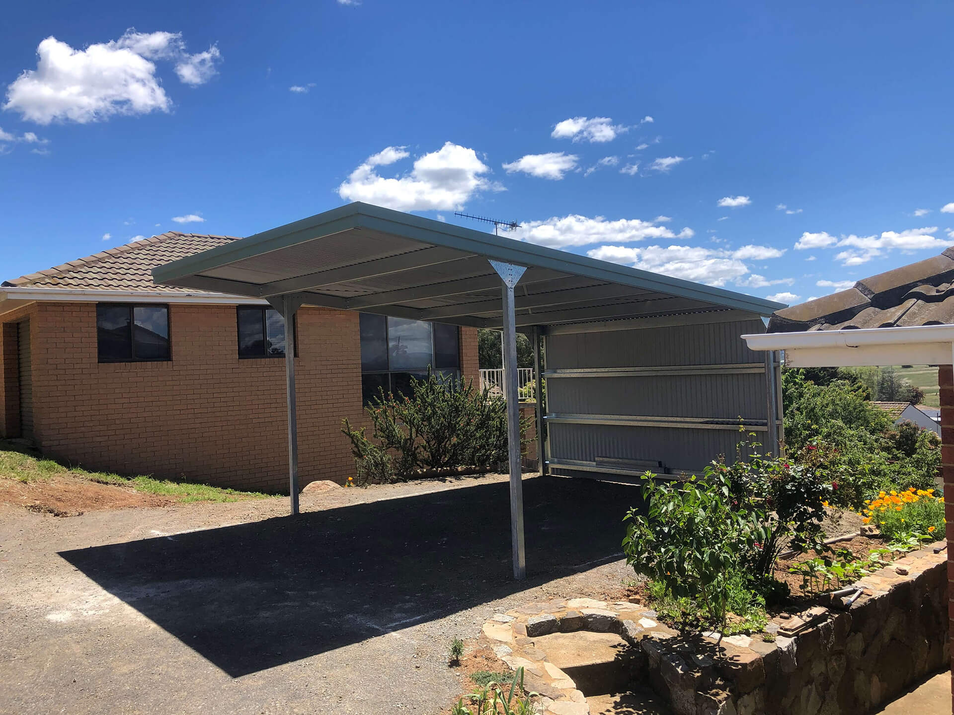 Flat roof Carport attached to house - Snowy Sheds