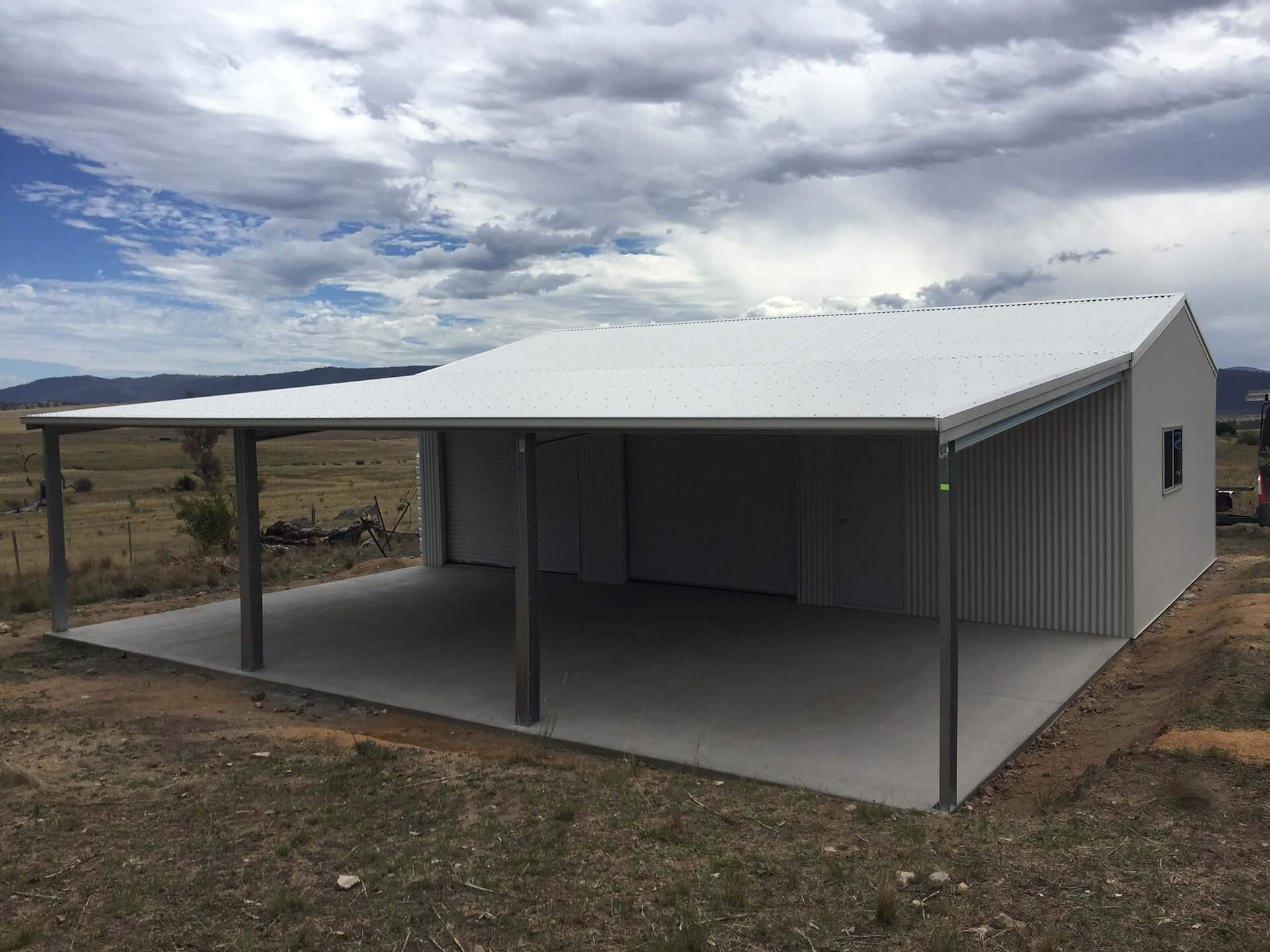 Flat roof Carport attached to house - Snowy Sheds