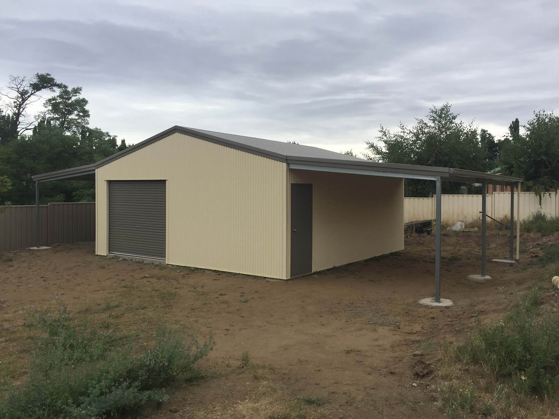 Flat roof Carport attached to house - Snowy Sheds