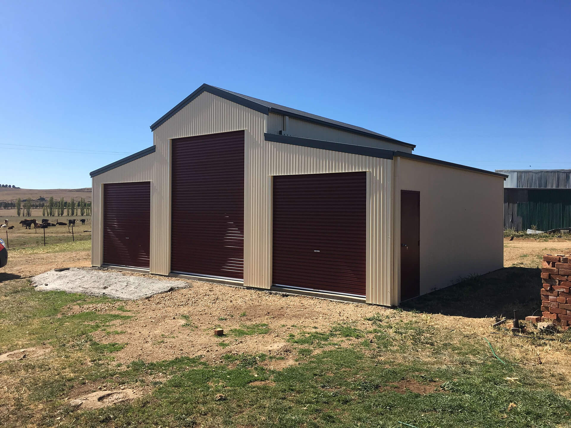 white 3 door American style barn shed side front view