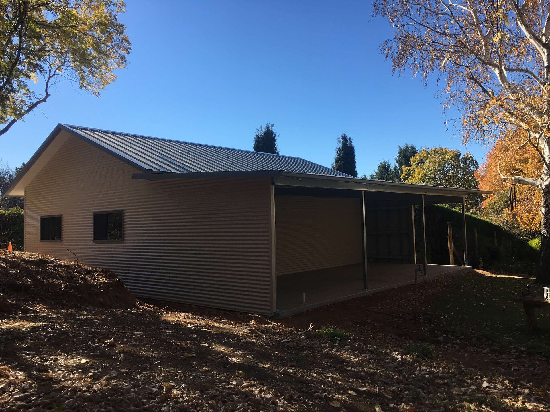 Flat roof Carport attached to house - Snowy Sheds