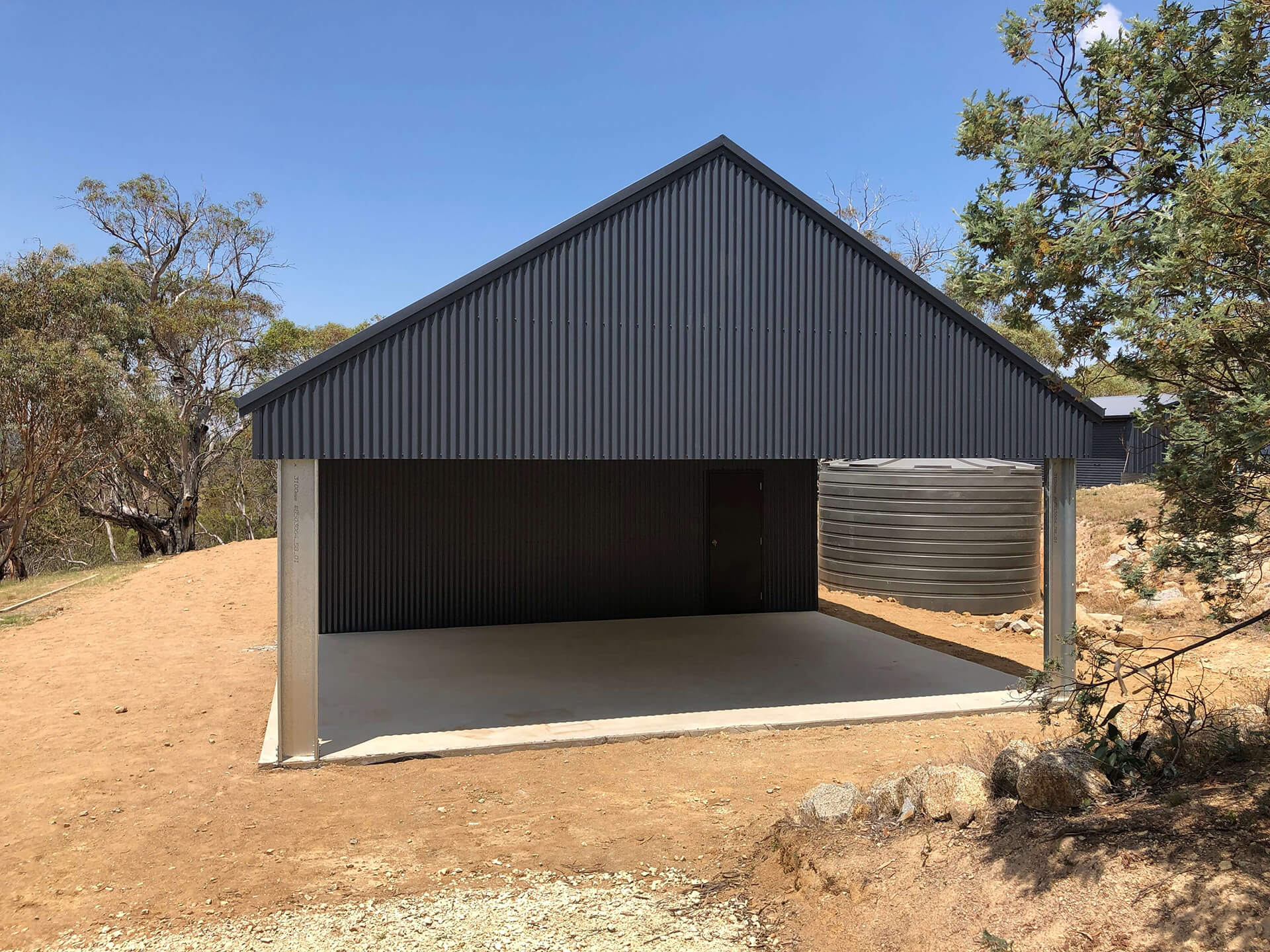 Flat roof Carport attached to house - Snowy Sheds